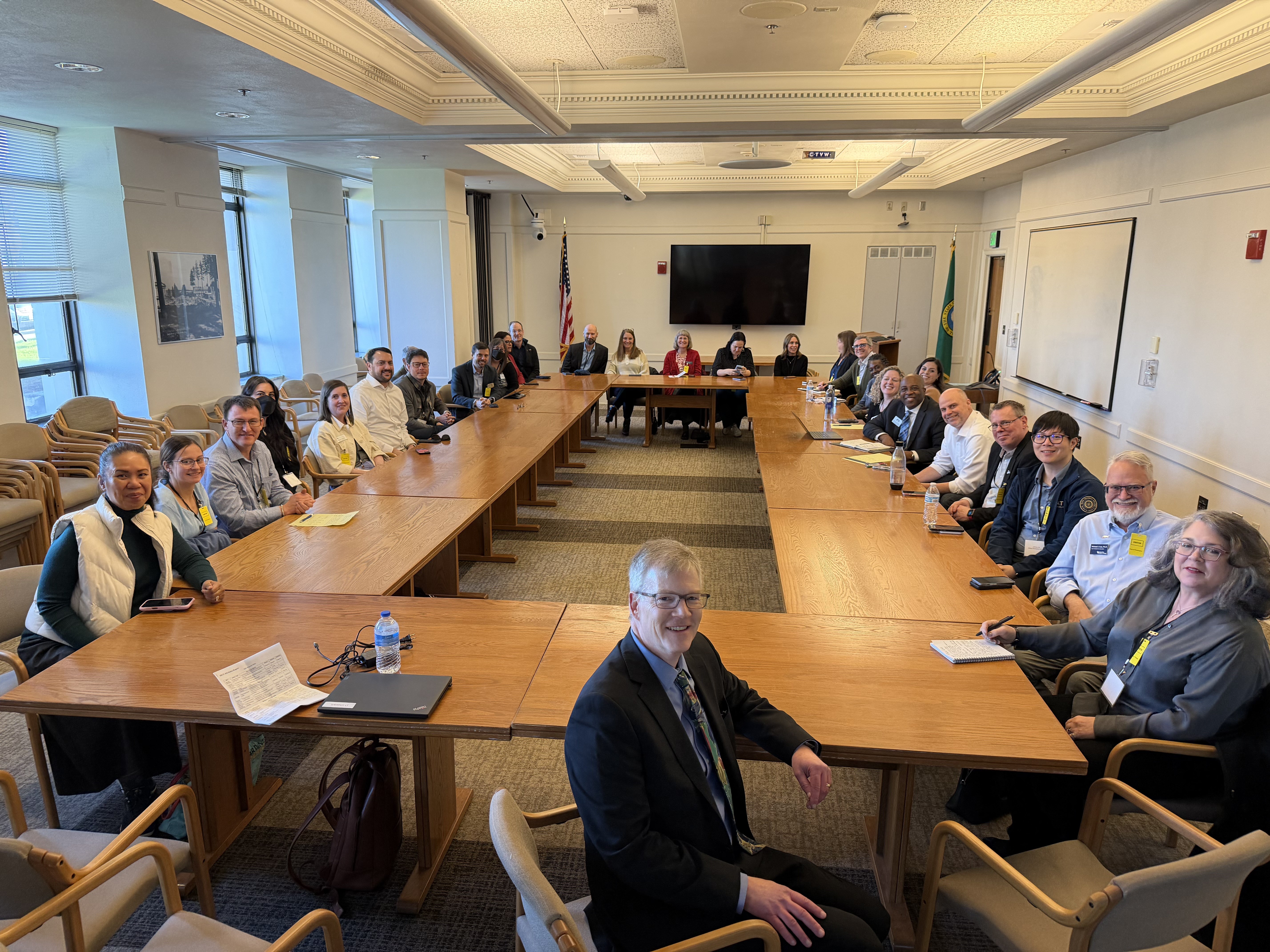 IC members sit at table with Rep. Dave Paul