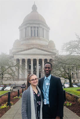 Kristina and Mustapha in front of the Legislative Building