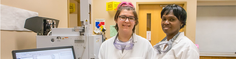 Two students standing in a lab