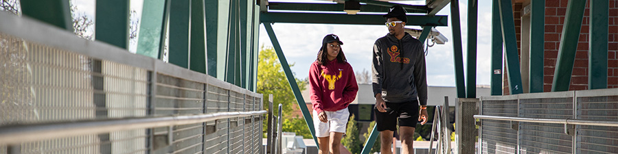 Two Yakima Valley College students walking on campus