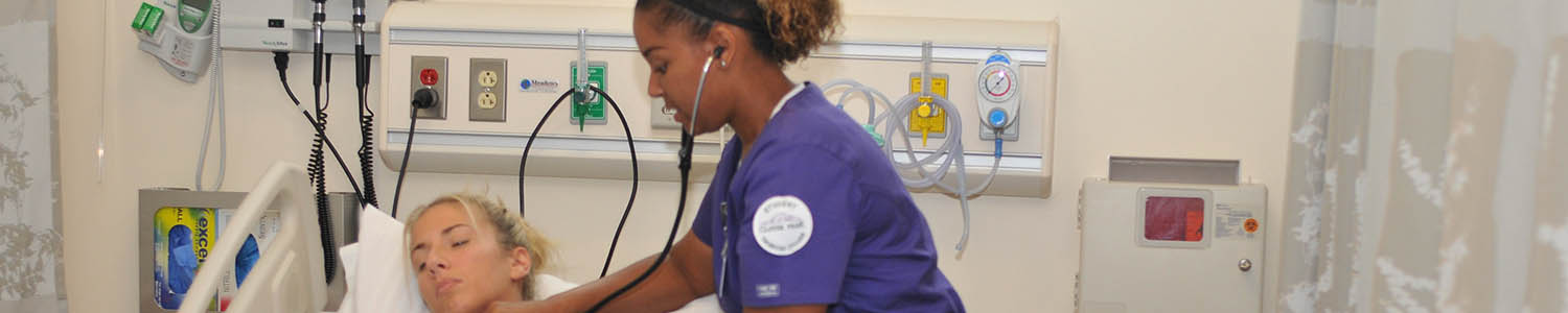 Nursing student listen's to a patient's heart