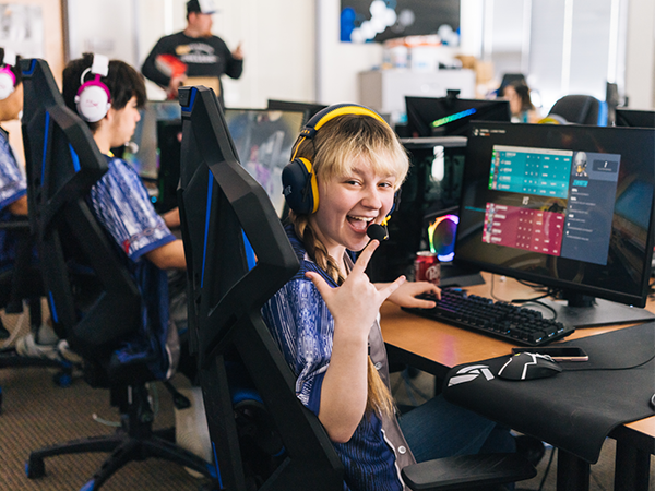 Esports student smiling at the camera